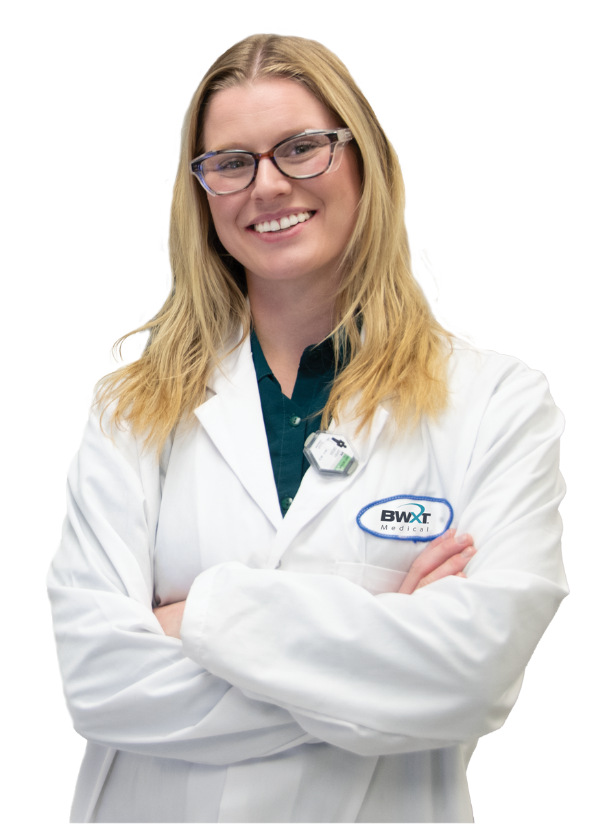Young woman smiling in labcoat.